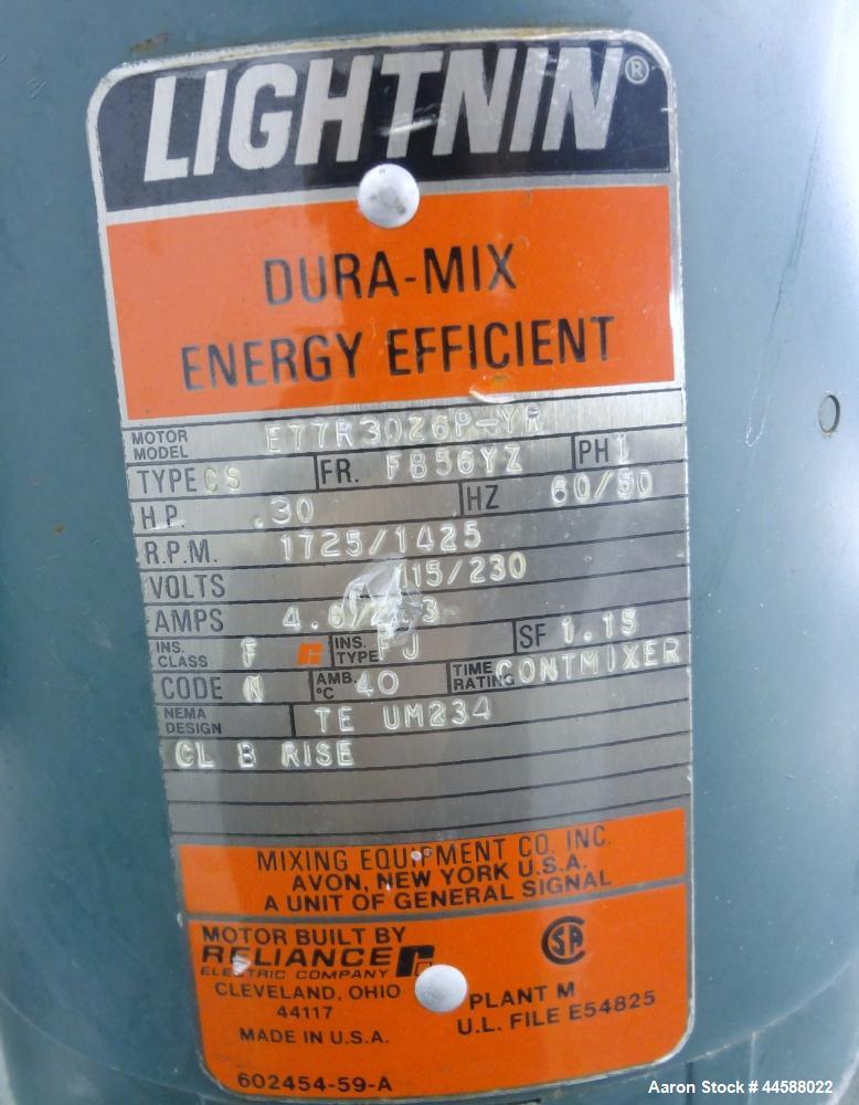 Used Perma-San Tank, 650 Gallons, Model OVS, 316 Stainless Steel, Vertical. Approximately 62" diameter x 51" straight side, open top with (2) 1/3 covers, sloped bottom. Lightnin clamp-on agitator, mo...