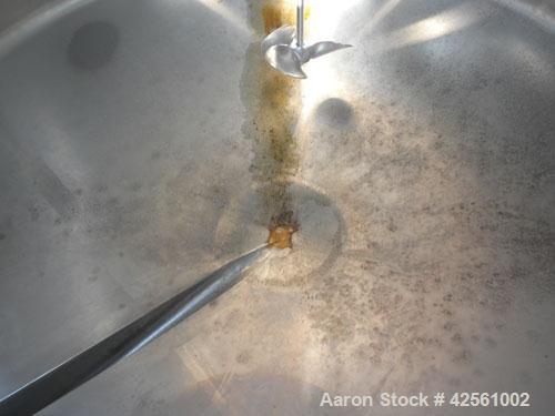 Used St. Regis Tank, Approximately 500 Gallon, 316 Stainless Steel, Vertical. 66" Diameter x 30" straight side, slight cone top and bottom. Lightnin clamp on agitator, model ND-1A. 1/2" Diameter shaf...
