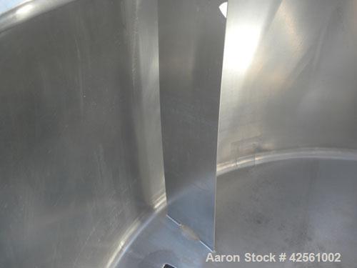 Used St. Regis Tank, Approximately 500 Gallon, 316 Stainless Steel, Vertical. 66" Diameter x 30" straight side, slight cone top and bottom. Lightnin clamp on agitator, model ND-1A. 1/2" Diameter shaf...
