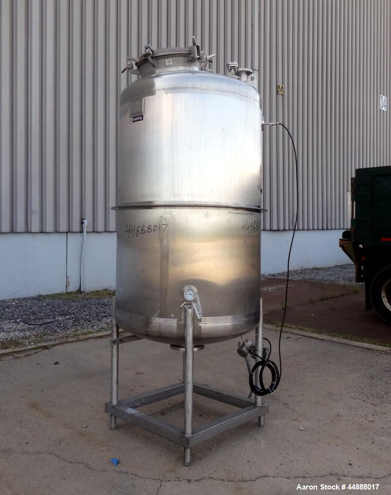 Used Tiger Steel Pressure Tank, 500 Gallon, 304L Stainless Steel, Vertical. 45" Diameter x 67" straight side, dished top & bottom. Internal rated 15psi/Full Vacuum at 350 degrees F. Openings top 1", ...