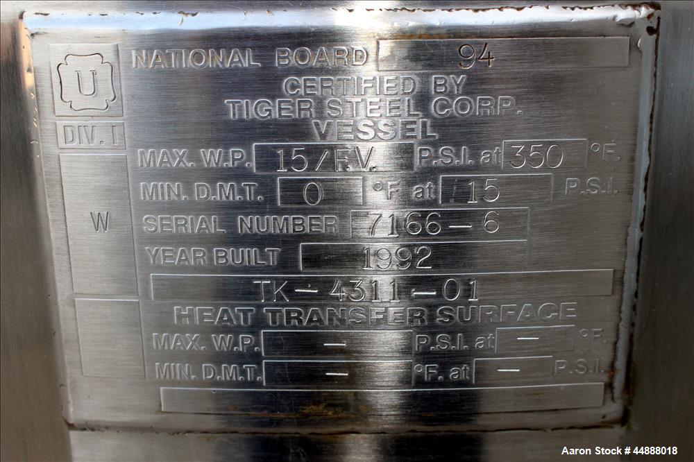 Used Tiger Steel Pressure Tank, 500 Gallon, 304L Stainless Steel, Vertical. 45" Diameter x 67" straight side, dished top & bottom. Internal rated 15psi/Full Vacuum at 350 degrees F. Openings top 1", ...
