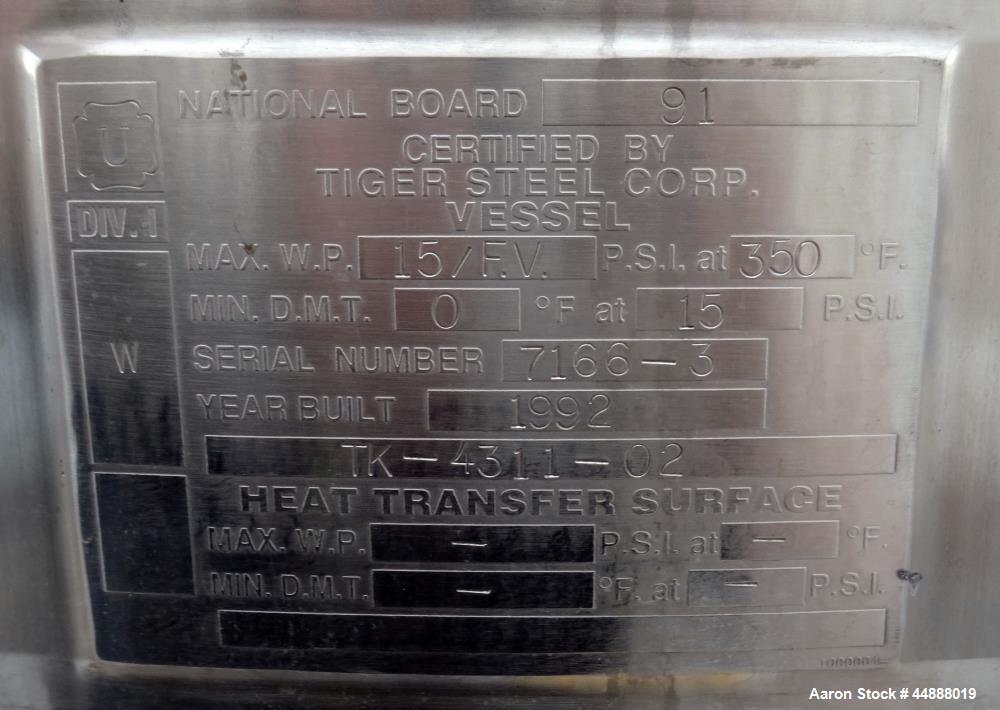 Used Tiger Steel Pressure Tank, 500 Gallon, 304L Stainless Steel, Vertical. 45" Diameter x 67" straight side, dished top & bottom. Internal rated 15psi/Full Vacuum at 350 degrees F. Openings top 1", ...
