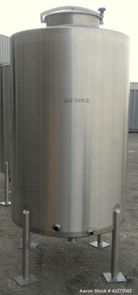 Unused- Walker Tank, 550 Gallon, 304 Stainless Steel, Vertical. 48" diameter x 70" straight side. Flat top, sloped bottom. (1) Spray ball. Openings top 1-1/2" tri-clamp, (2) 3" tri-clamp, 19" manway ...