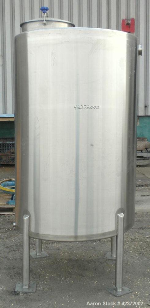 Unused- Walker Tank, 550 Gallon, 304 Stainless Steel, Vertical. 48" diameter x 70" straight side. Flat top, sloped bottom. (1) Spray ball. Openings top 1-1/2" tri-clamp, (2) 3" tri-clamp, 19" manway ...