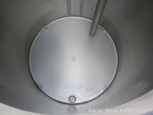 Unused- Walker Tank, 550 Gallon, 304 Stainless Steel, Vertical. 48" diameter x 70" straight side. Flat top, sloped bottom. (1) Spray ball. Openings top 1-1/2" tri-clamp, (2) 3" tri-clamp, 19" manway ...