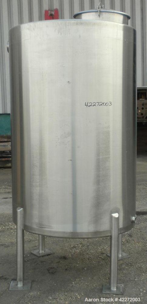 Unused- Walker Tank, 550 Gallon, 304 Stainless Steel, Vertical. 48" diameter x 70" straight side. Flat top, sloped bottom. (1) Spray ball. Openings top 1-1/2" tri-clamp, (2) 3" tri-clamp, 19" manway ...