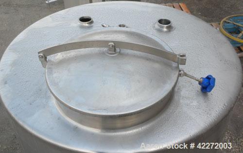 Unused- Walker Tank, 550 Gallon, 304 Stainless Steel, Vertical. 48" diameter x 70" straight side. Flat top, sloped bottom. (1) Spray ball. Openings top 1-1/2" tri-clamp, (2) 3" tri-clamp, 19" manway ...