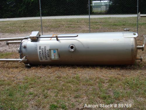 USED: Walker approximate 550 gallon, T304L stainless steel, tank. Approximately 3' diameter x 10' straight side. Dished heads. Miscellaneous side and top openings. 3" center bottom outlet. Built in 1...