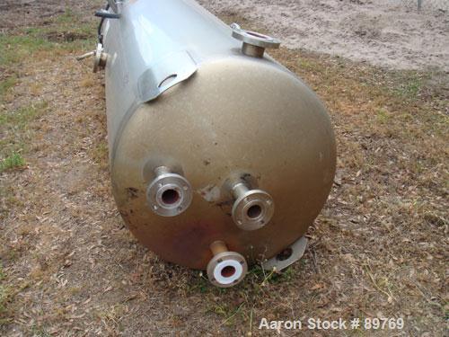 USED: Walker approximate 550 gallon, T304L stainless steel, tank. Approximately 3' diameter x 10' straight side. Dished heads. Miscellaneous side and top openings. 3" center bottom outlet. Built in 1...