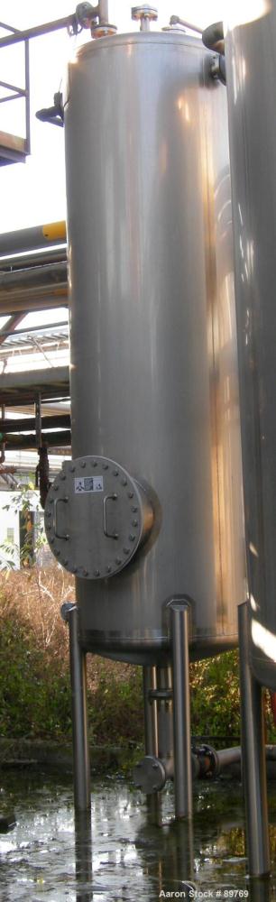 USED: Walker approximate 550 gallon, T304L stainless steel, tank. Approximately 3' diameter x 10' straight side. Dished heads. Miscellaneous side and top openings. 3" center bottom outlet. Built in 1...