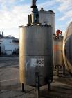 Used Tank, 550 Gallon, 304 Stainless Steel, Vertical.  48” Diameter x 72” straight side, flat top, 25” coned bottom.  Top entering agitator, driven by a 3 hp motor. Center bottom outlet.  Mounted on ...