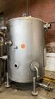 Used Tank, Approximate 950 Gallon, Stainless Steel, Vertical. Approximate 60