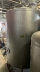 Used Tank, Approximate 950 Gallon, Stainless Steel, Vertical. Approximate 60