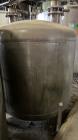 Used Tank, Approximate 950 Gallon, Stainless Steel, Vertical. Approximate 60