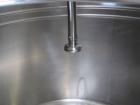 Used Tank, 580 Gallon, 304 Stainless Steel, Vertical. Approximate 62” diameter x 45” straight side, flat top with a bolt on cover with a 1/3 hinged opening, sloped bottom. Side bottom entering agitat...