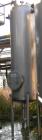USED: Walker approximate 550 gallon, T304L stainless steel, tank. Approximately 3' diameter x 10' straight side. Dished heads. Miscellaneous side and top openings. 3