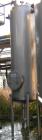 USED: Walker approximate 550 gallon, T304L stainless steel, tank. Approximately 3' diameter x 10' straight side. Dished heads. Miscellaneous side and top openings. 3