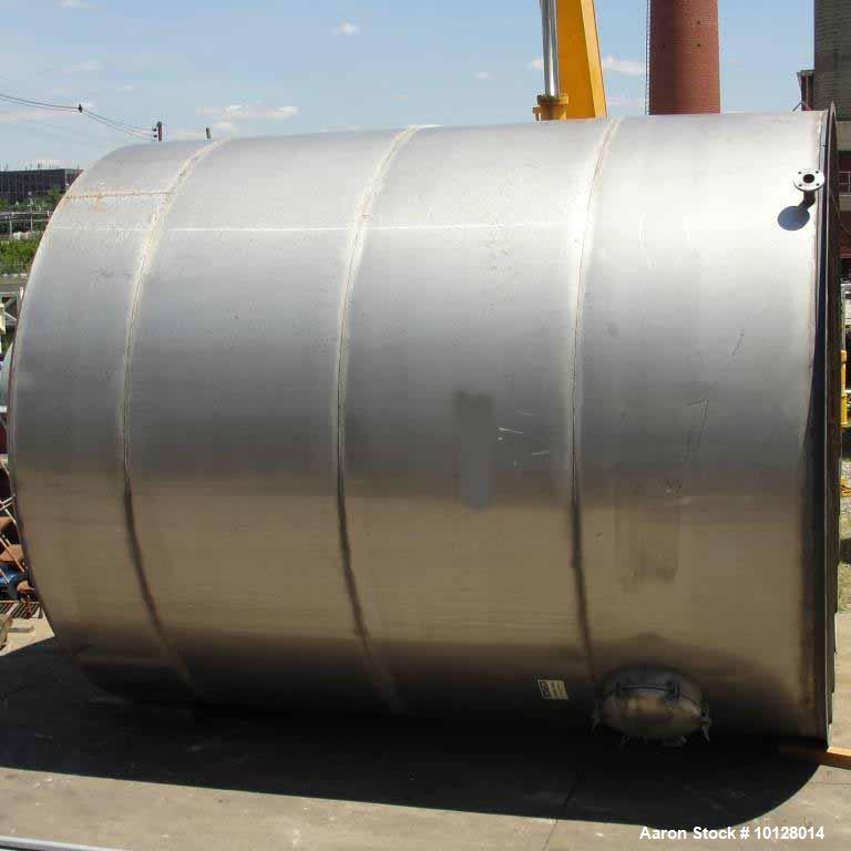 Used 12,000 Gallon Vertical Stainless Steel Tank. Dome Top and Sloped Bottom. Diameter is 144", Height 174", dome is 20", straight side height 168". Top has 22" manway and (3) 3 " flanges. Side has 2...