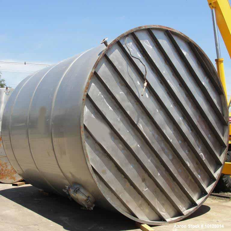 Used 12,000 Gallon Vertical Stainless Steel Tank. Dome Top and Sloped Bottom. Diameter is 144", Height 174", dome is 20", straight side height 168". Top has 22" manway and (3) 3 " flanges. Side has 2...