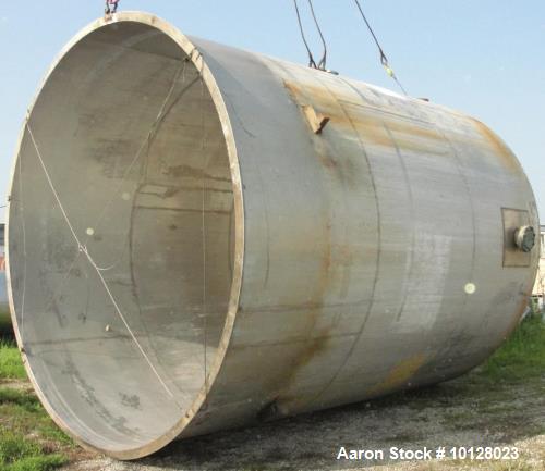 Used 11,900 Gallon Vertical Stainless Steel Tank. Interior dimensions 140" diameter x 175" tall, open top, sloped bottom with a 5" flanged outlet that drops down and out to the side. Side has a 6" fl...