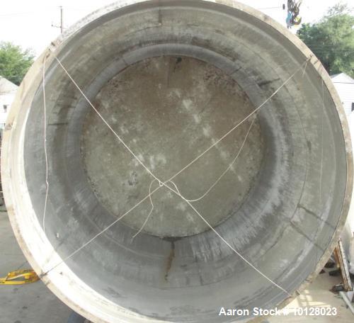 Used 11,900 Gallon Vertical Stainless Steel Tank. Interior dimensions 140" diameter x 175" tall, open top, sloped bottom with a 5" flanged outlet that drops down and out to the side. Side has a 6" fl...