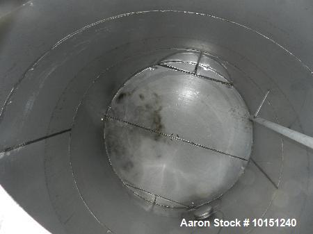 Used 5900 Gallon (Approximately), 304 Stainless Steel Vertical Storage Tank. Approximately 9'3" diameter x 12' Straight Side. Cone Top. Flat Bottom. Top Head has 3-2" couplings, 1-2" center vent and ...