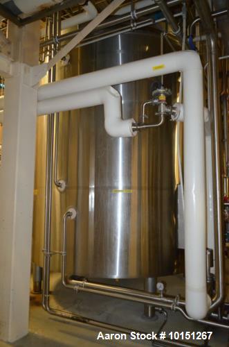 Used- 6,000 Gallon (Approximately) Stainless Steel Vertical Aseptic Product Tank. Dome top, flat bottom off center. Top moun...