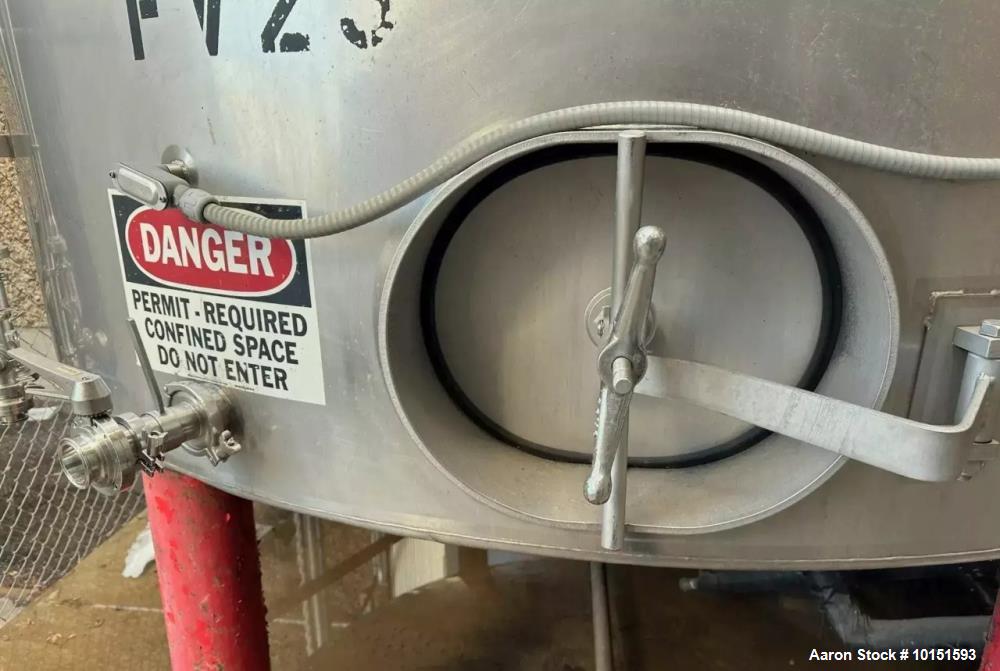 Used Approximately 8,400 Gallon (200 BBL) Stainless Steel, Jacketed Tank. Approximate 10' diameter. x 18'6" overall height. Dished top, cone bottom. Glycol Jacketed, Zwickel Valve, Top and Bottom Man...