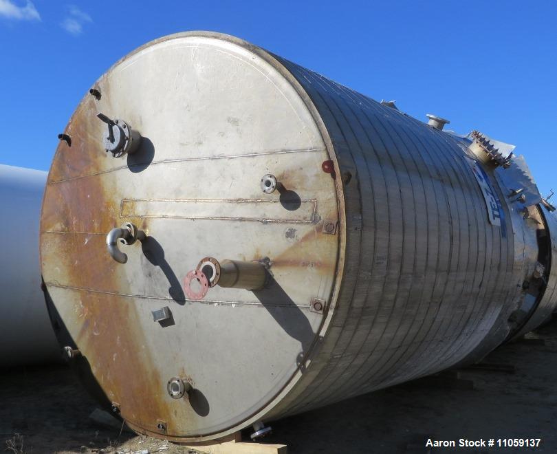 Used Tate Metal Works 15,200 Gallon Stainless Steel Storage Tank. Approximately 12' diameter x 18' T/T. Flat bottom and cone top.
