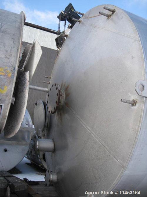 Used-15,000 Gallon Stainless Steel Tank, approximately 10'6" diameter x 23' straight side, slight cone top, flat bottom.