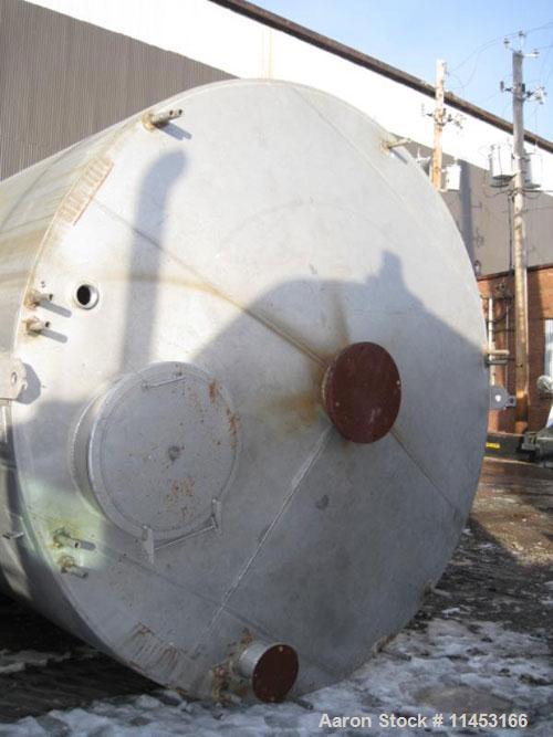 Used-15,000 Gallon Stainless Steel Tank, approximately 10'6" diameter x 23' straight side, slight cone top, flat bottom.