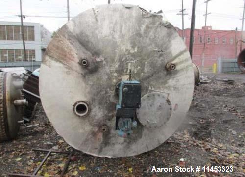 Used 12,000 Gallon, 304 Stainless Steel Tank. 12' diameter x 16' straight side; 4' carbon steel skirt. Dished ends, 24" side bottom manway with top entering 2 tier 3 blade turbine style Chemineer agi...