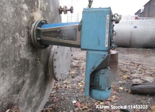 Used 12,000 Gallon, 304 Stainless Steel Tank. 12' diameter x 16' straight side; 4' carbon steel skirt. Dished ends, 24" side bottom manway with top entering 2 tier 3 blade turbine style Chemineer agi...