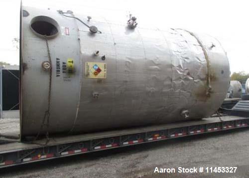 Used- 12,000 Gallon Stainless Steel Tank. 12' diameter x 16' straight side. 4' carbon steel skirt, dished ends, 24" side bot...