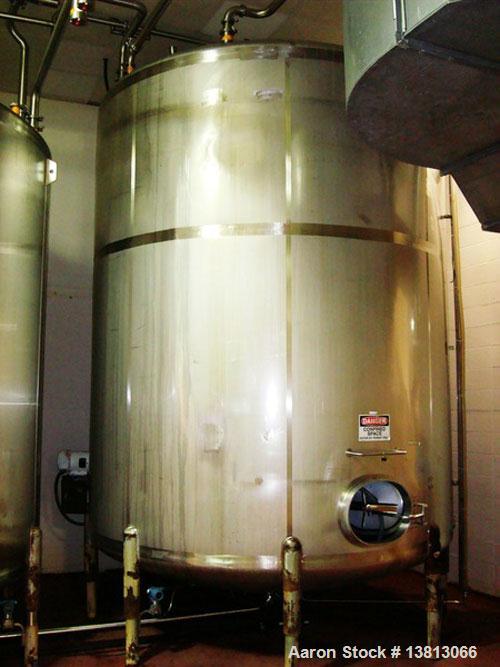 Used 7,500 Gallon Stainless Steel Mix Tank. 10' diameter x 11'6" straight side. 15'6" overall height. 8 mild steel legs. Side agitator, 5 hp, 208-230-460V, 3/60. Dished heads.