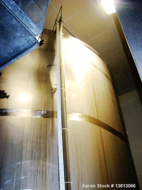 Used 7,500 Gallon Stainless Steel Mix Tank. 10' diameter x 11'6" straight side. 15'6" overall height. 8 mild steel legs. Side agitator, 5 hp, 208-230-460V, 3/60. Dished heads.
