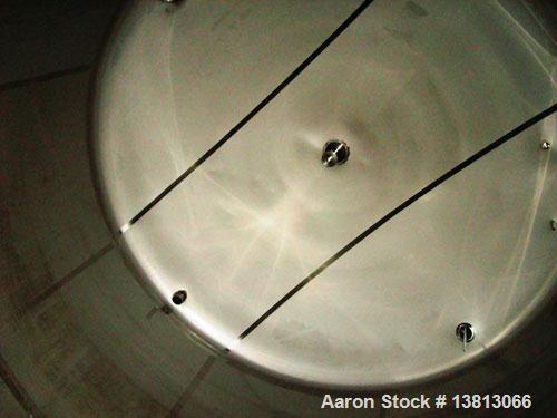 Used 7,500 Gallon Stainless Steel Mix Tank. 10' diameter x 11'6" straight side. 15'6" overall height. 8 mild steel legs. Side agitator, 5 hp, 208-230-460V, 3/60. Dished heads.