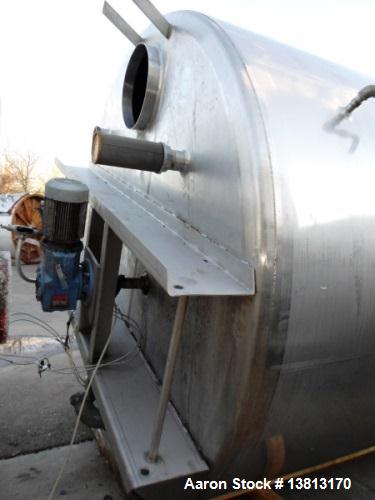 Used 5000 Gallon Jacketed SFI Stainless Steel Storage Tank. 10' diameter, 11 1/2' straight wall. Top agitated with 5 hp 3/60/240/480V motor, 1680 RPM.