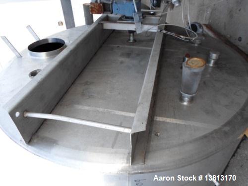 Used 5000 Gallon Jacketed SFI Stainless Steel Storage Tank. 10' diameter, 11 1/2' straight wall. Top agitated with 5 hp 3/60/240/480V motor, 1680 RPM.
