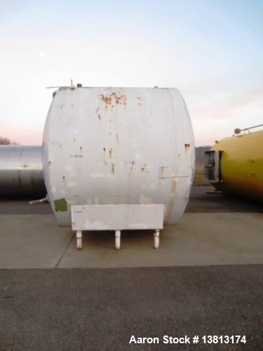 Used- 5,000 Gallon Mild Steel Exterior/Stainless Steel Tank. Interior previously used to store sweeteners. End manway, sight...