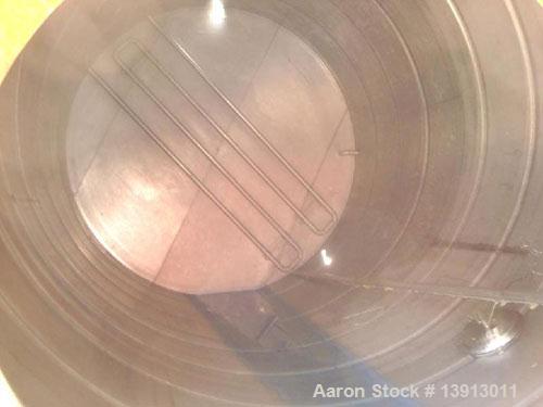 Used 15,000 Gallon Vertical 316 Stainless Steel Storage Tank. 136" diameter x 240" straight side. Tank has internal heating coils. No rating. Overall height of 264 inches.