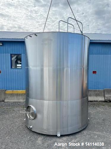 Unused- 6,600 Gallon 304 Stainless Steel Tank. (24,984 Liters) Interior Dimensions: 9'6" diameter x 12' straight side. Top and bottom side manways with lids. CIP Spray Ball. Top side inlets 2" Tri-cl...