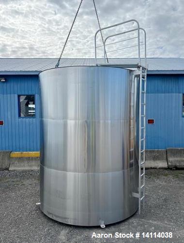 Unused- 6,600 Gallon 304 Stainless Steel Tank. (24,984 Liters) Interior Dimensions: 9'6" diameter x 12' straight side. Top and bottom side manways with lids. CIP Spray Ball. Top side inlets 2" Tri-cl...
