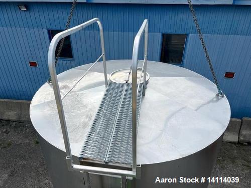 Unused- 6,600 Gallon 304 Stainless Steel Tank. (24,984 Liters) Interior Dimensions: 9'6" diameter x 12' straight side. Top and bottom side manways with lids. CIP Spray Ball. Top side inlets 2" Tri-cl...