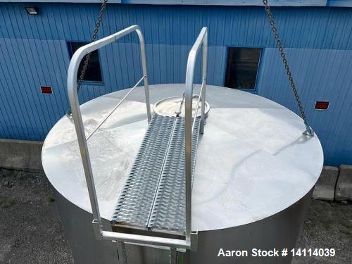 Unused- 6,600 Gallon 304 Stainless Steel Tank. (24,984 Liters) Interior Dimensions: 9'6" diameter x 12' straight side. Top a...