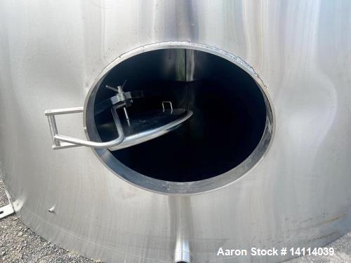 Unused- 6,600 Gallon 304 Stainless Steel Tank. (24,984 Liters) Interior Dimensions: 9'6" diameter x 12' straight side. Top a...