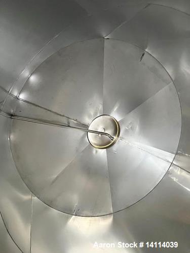 Unused- 6,600 Gallon 304 Stainless Steel Tank. (24,984 Liters) Interior Dimensions: 9'6" diameter x 12' straight side. Top and bottom side manways with lids. CIP Spray Ball. Top side inlets 2" Tri-cl...