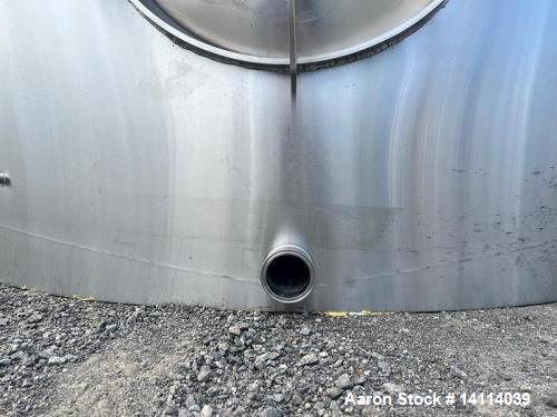 Unused- 6,600 Gallon 304 Stainless Steel Tank. (24,984 Liters) Interior Dimensions: 9'6" diameter x 12' straight side. Top and bottom side manways with lids. CIP Spray Ball. Top side inlets 2" Tri-cl...