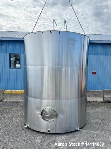 Unused- 6,600 Gallon 304 Stainless Steel Tank. (24,984 Liters) Interior Dimensions: 9'6" diameter x 12' straight side. Top and bottom side manways with lids. CIP Spray Ball. Top side inlets 2" Tri-cl...