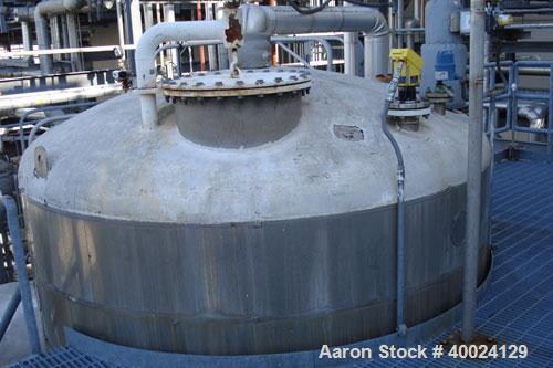 Used: Feldmeier tank, 6000 gallon, 316L stainless steel, vertical. 108" diameter x 144" straight side, dished top and bottom. Internal rated 10 psi at 150 deg.f.. Openings top 2",(3) 3",(2)4", 24" ma...